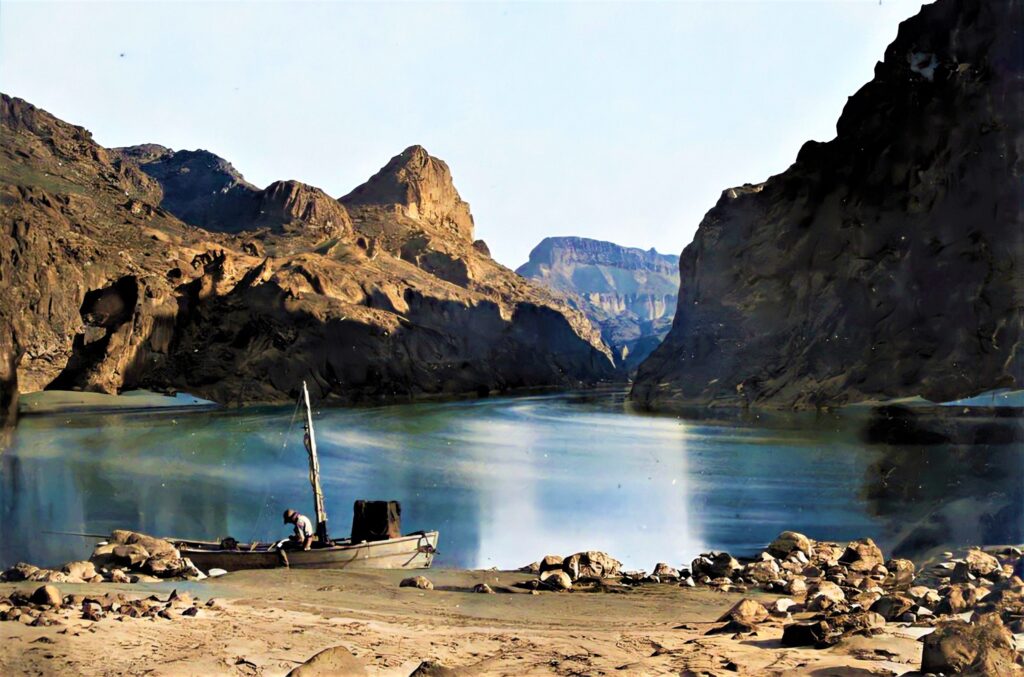 One o f the Old West Photos, a man sitting on the boat.